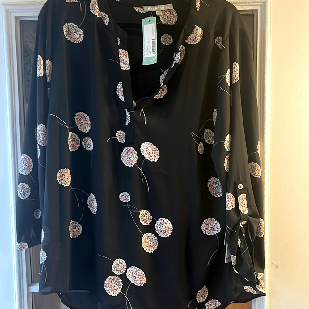 100% polyester. Womens Koda Split Neck Blouse. Brand new with tags.